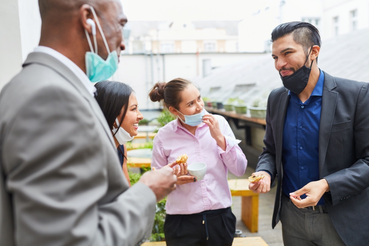 group of 30-something friends gathering with their masks down