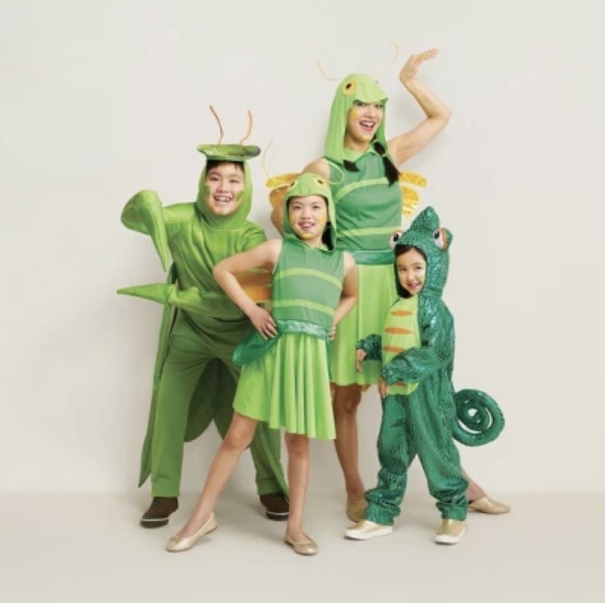 family dressed as green bugs, family halloween costumes