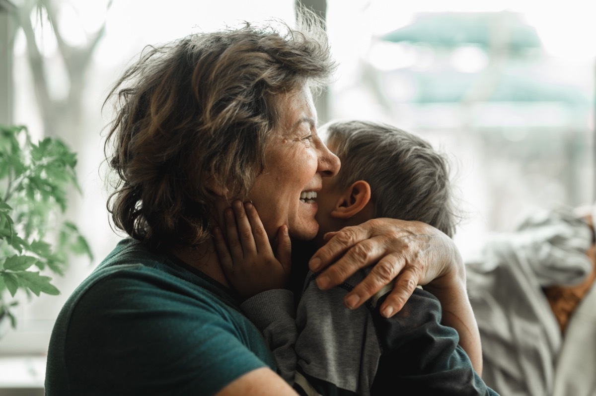 Grandmother and grandson hugging