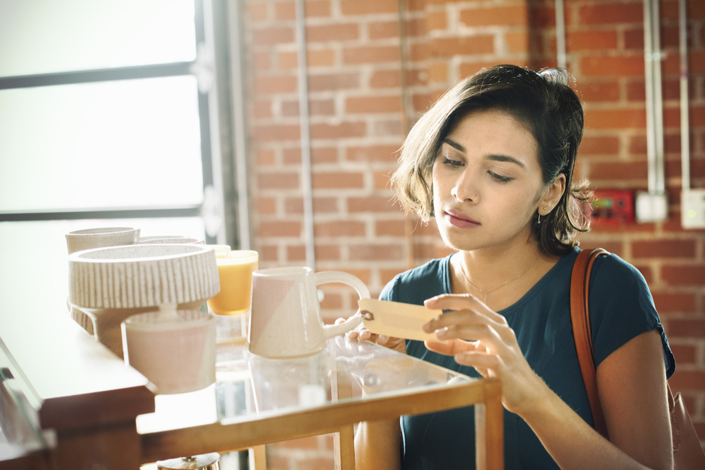 Woman Checking Price Tag Worst Things to Say to Customer Service