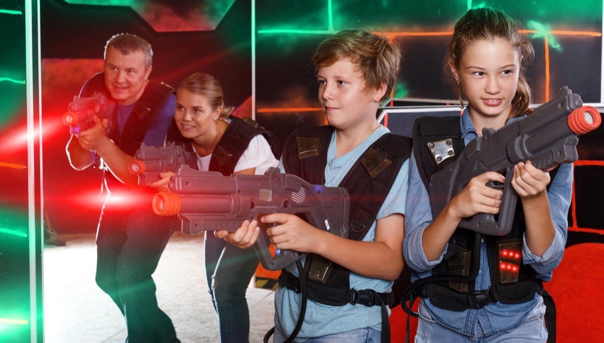 Family playing laser tag together