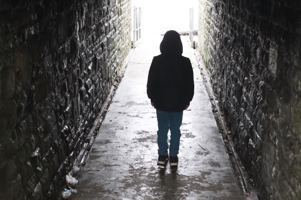 boy in underground tunnel