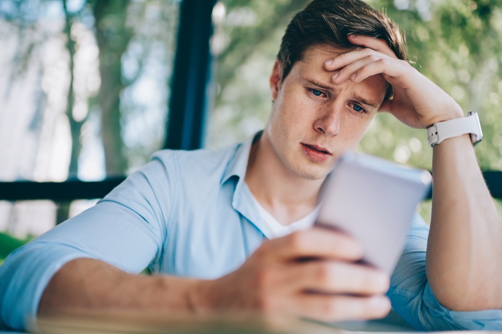 Annoyed worker on his phone