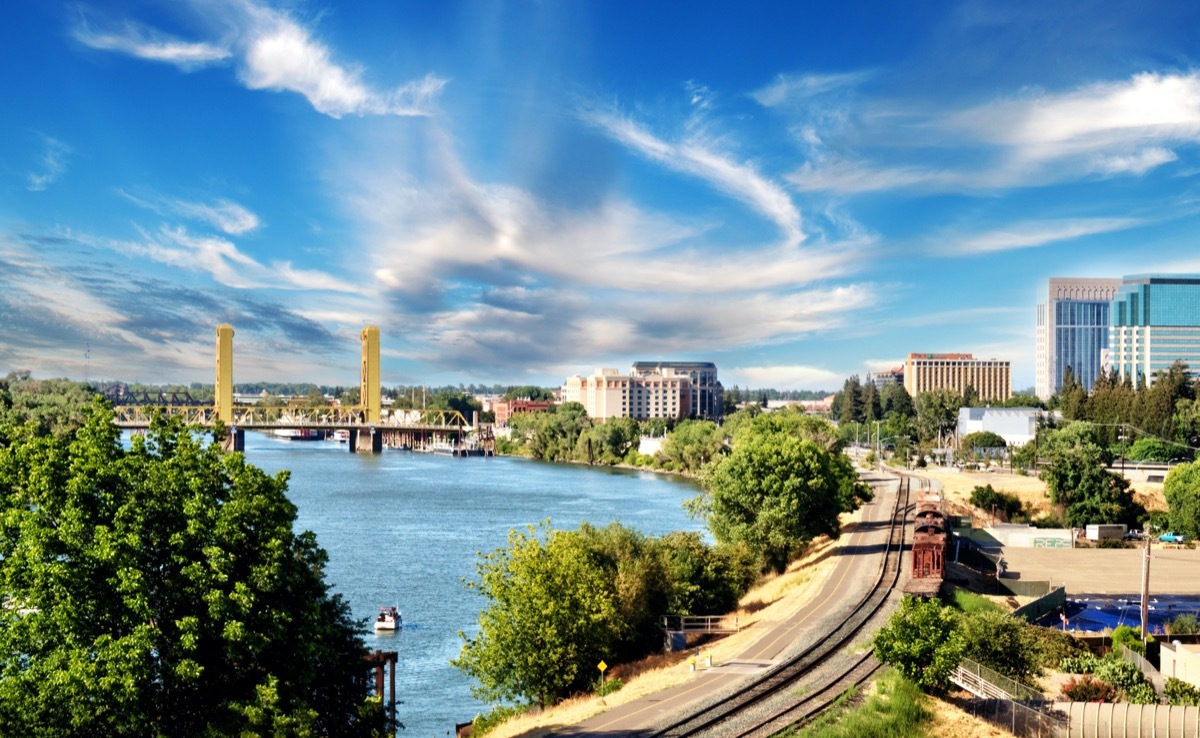 cityscape photo of highway, bridge, and buildings in downtown Sacramento, California