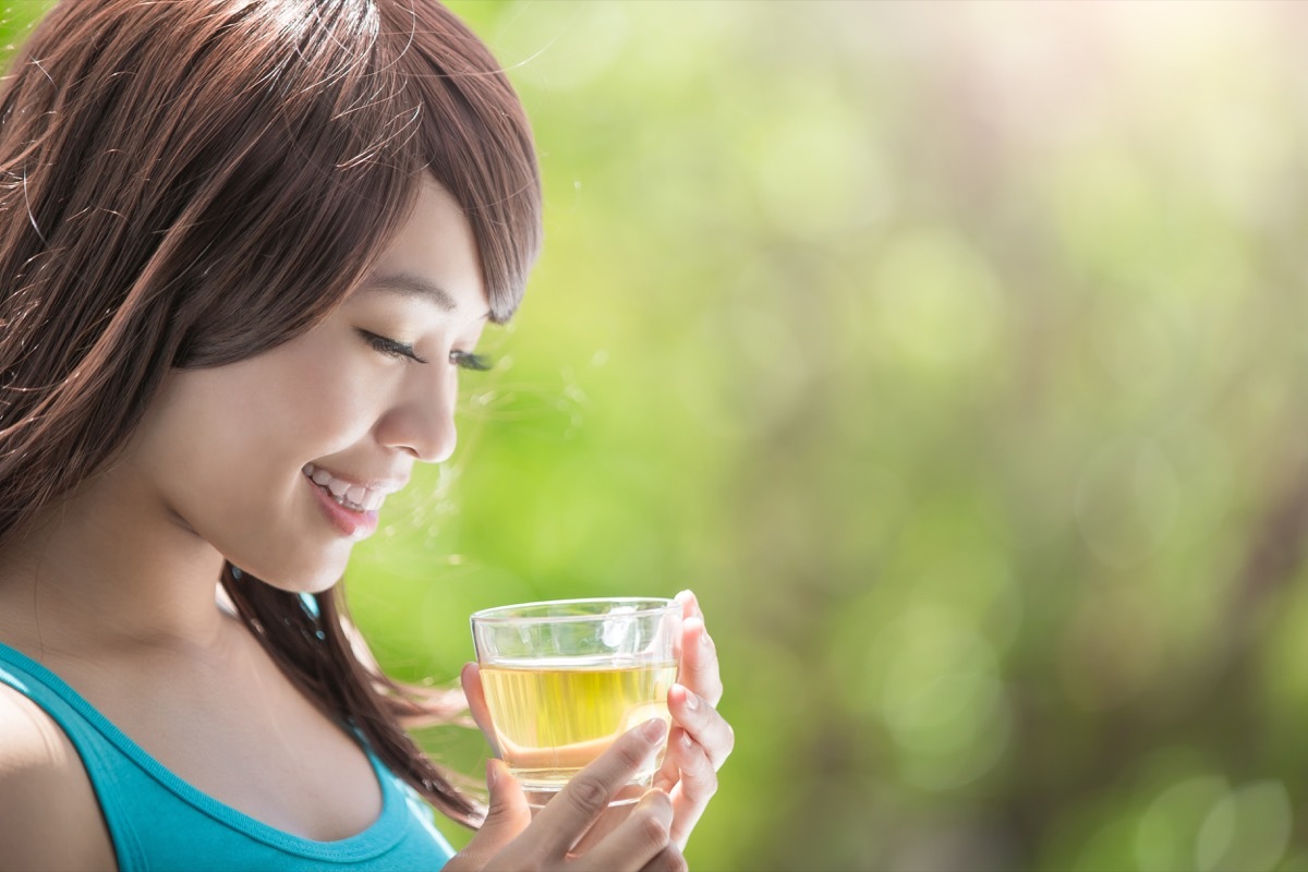 Woman drinking green or white tea