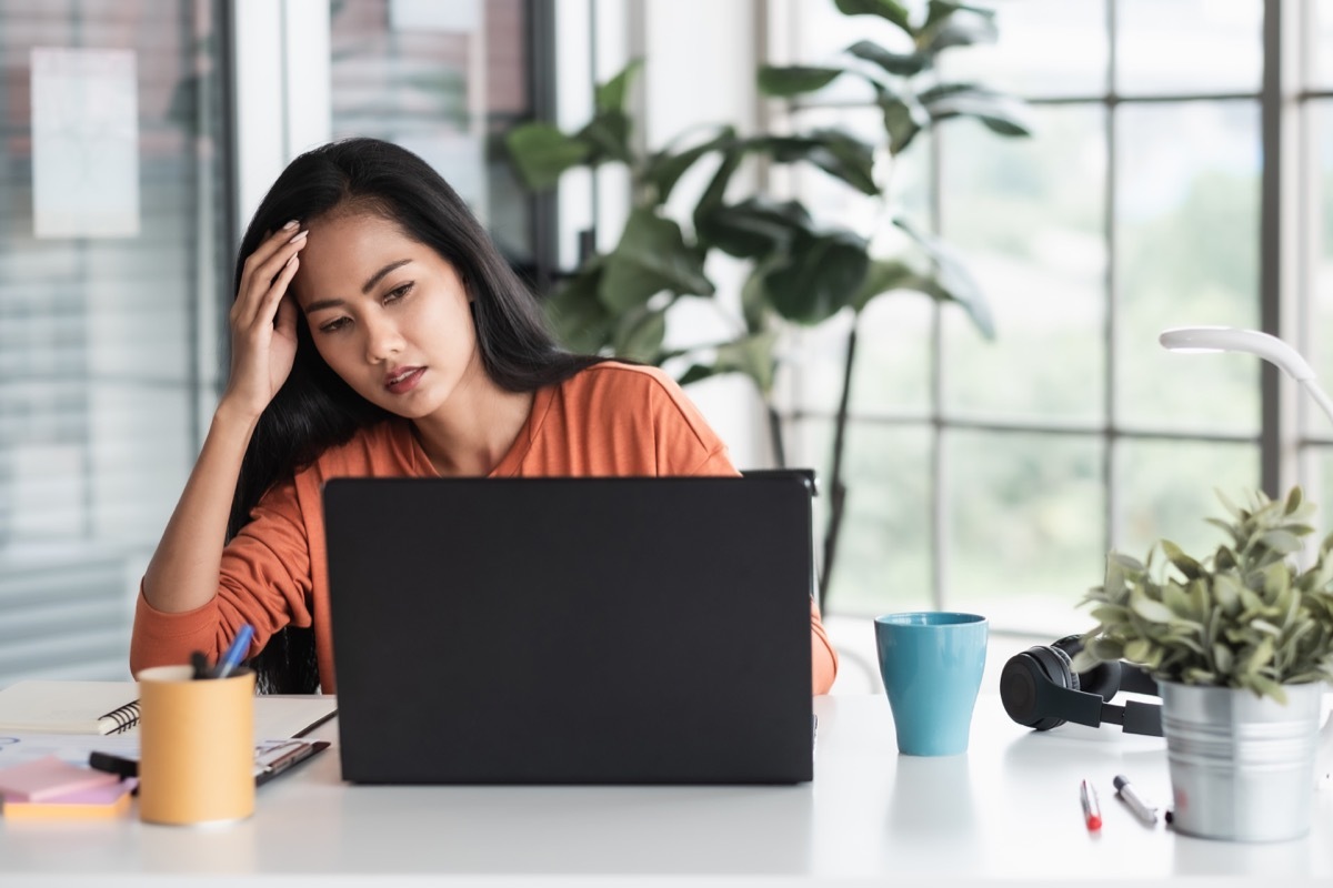 woman get stress about project in front of laptop while working from home.new normal with technology lifestyle