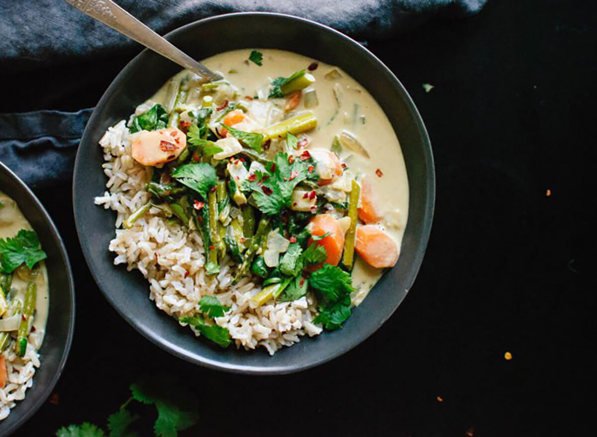 thai green curry in bowl with spoon