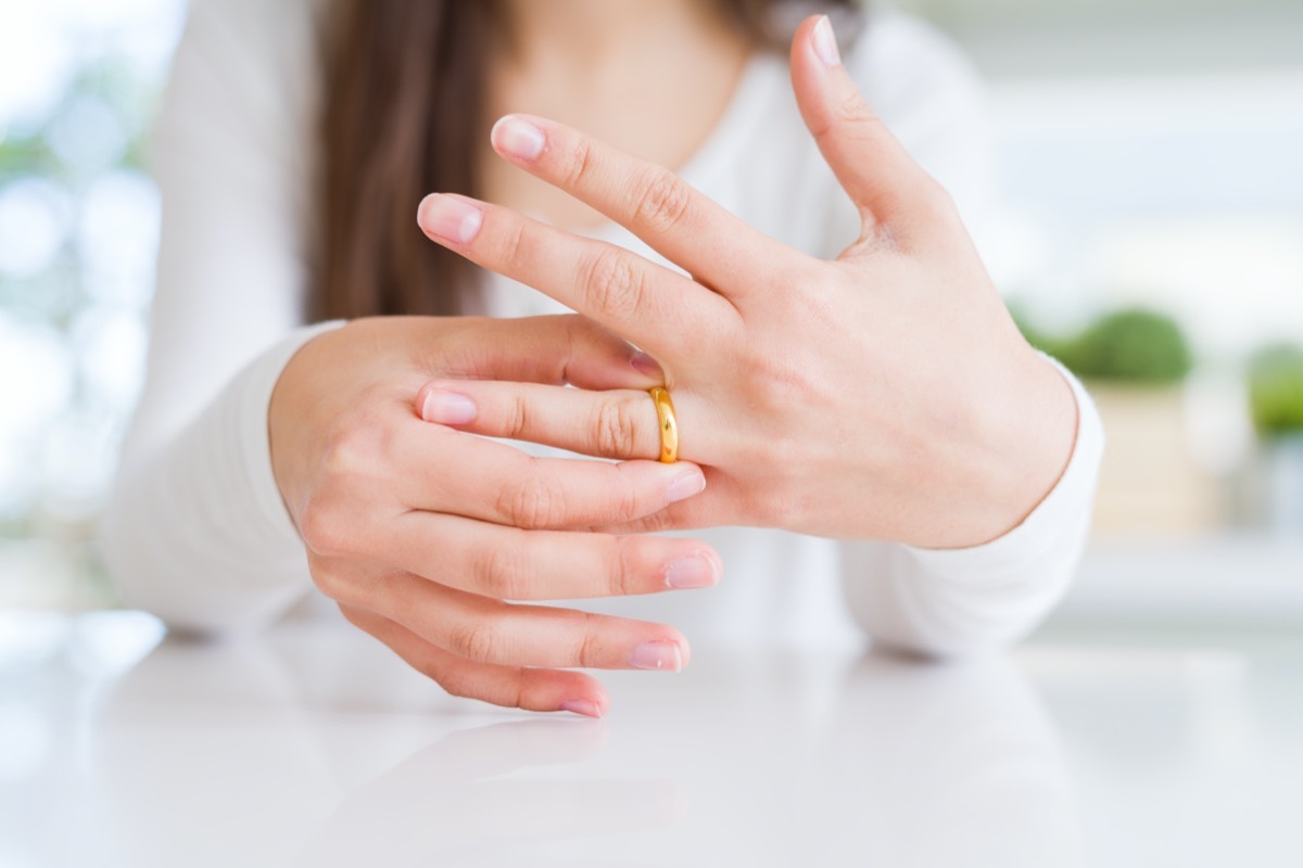 Close up of woman hands wearing wedding alliance ring