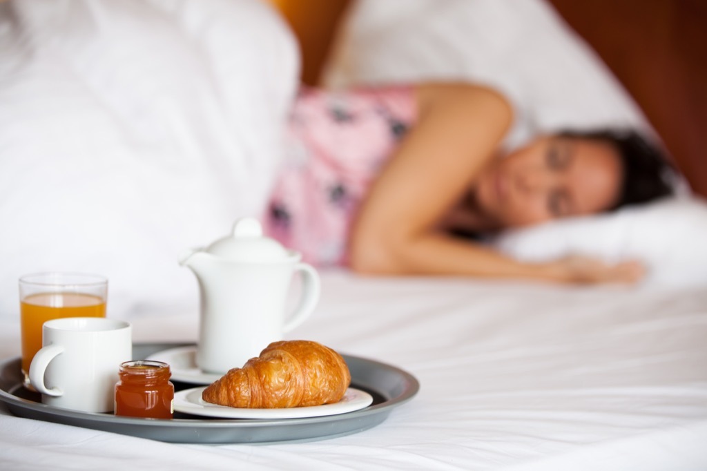 coffee nap happy and energized woman in bed