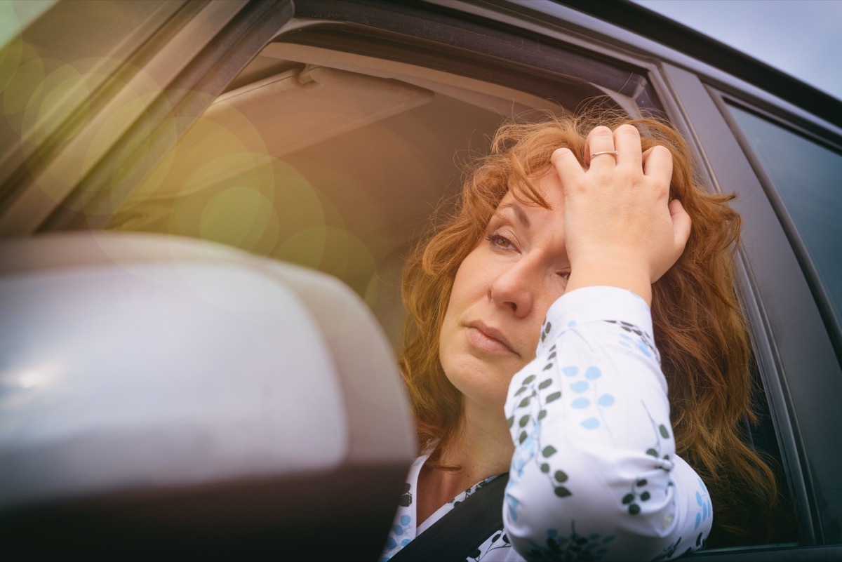 woman unhappy in car