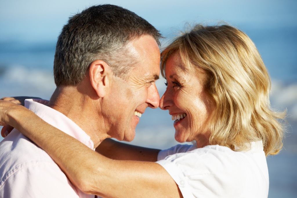 middle-aged couple laughing and looking younger