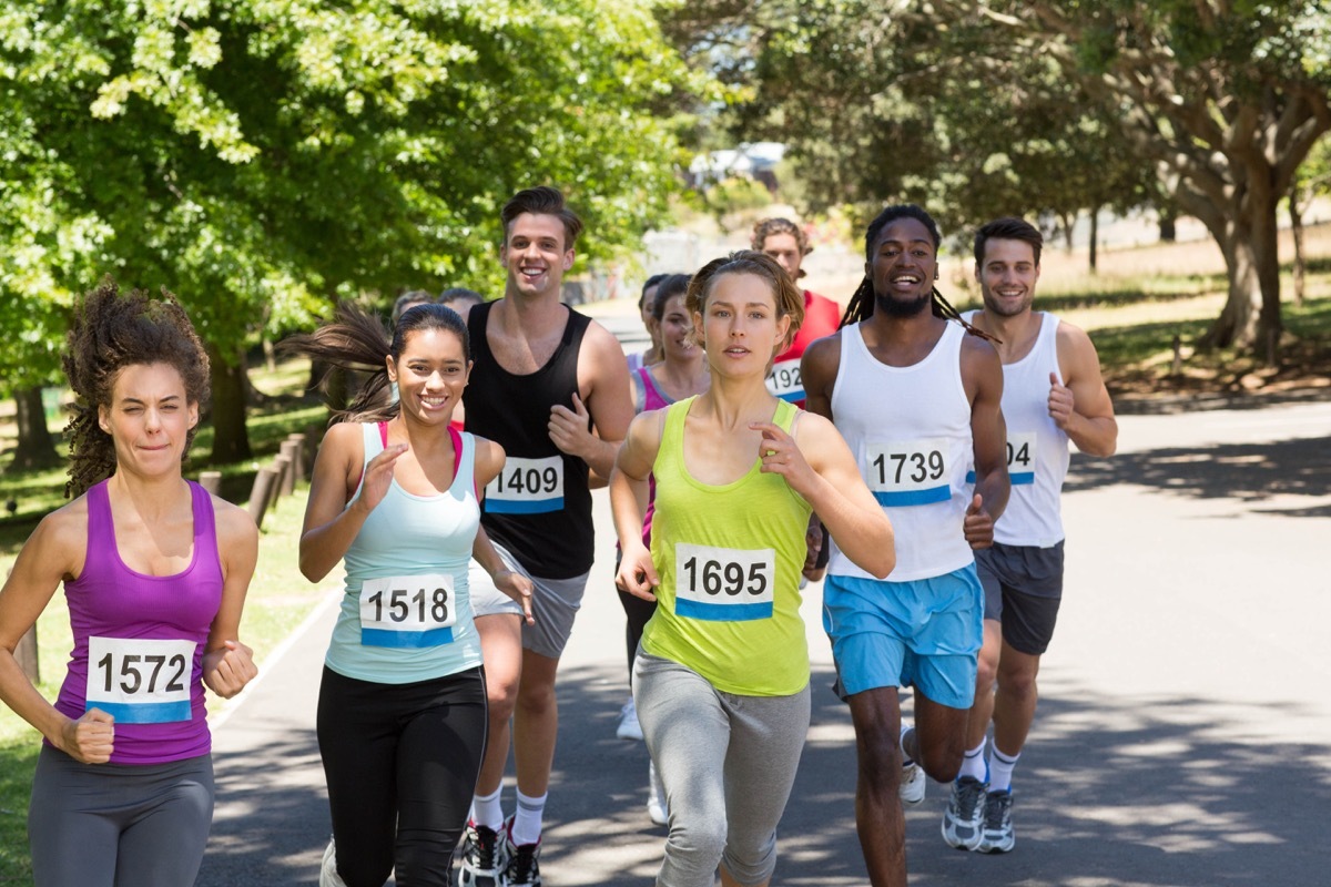 Group of people running a race multicultural