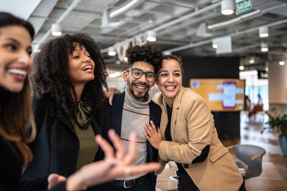 Coworkers being excited together