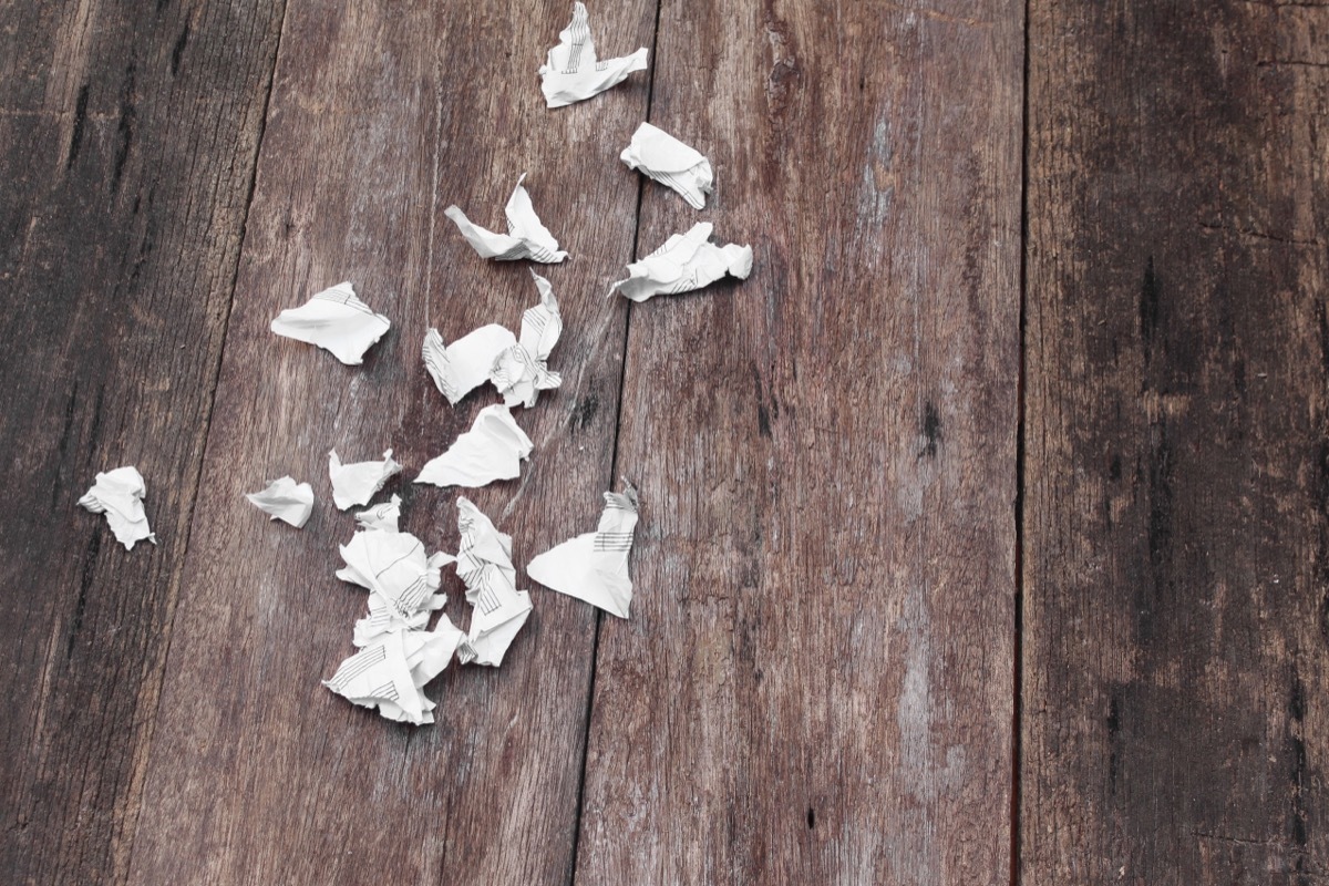 shredded paper on wooden floor