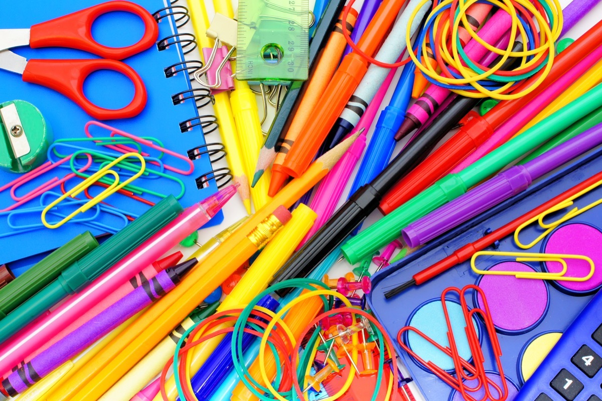 school supplies pile paper clips scissors pencils markers