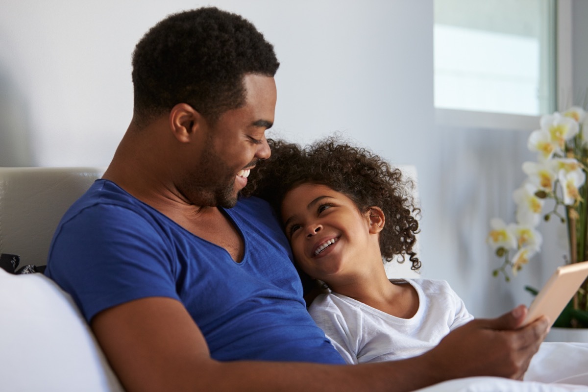 Father and daughter on tablet