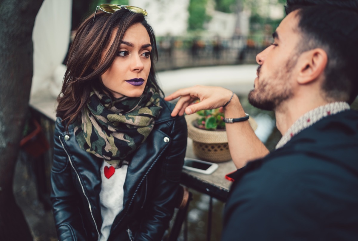 young couple discussing a problem in the cafe