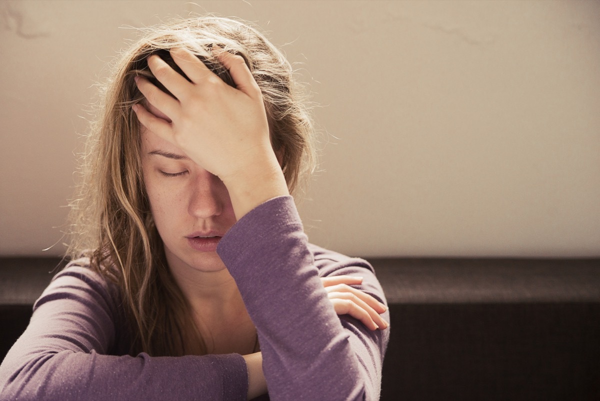 Woman feeling pressure on her brain in pain