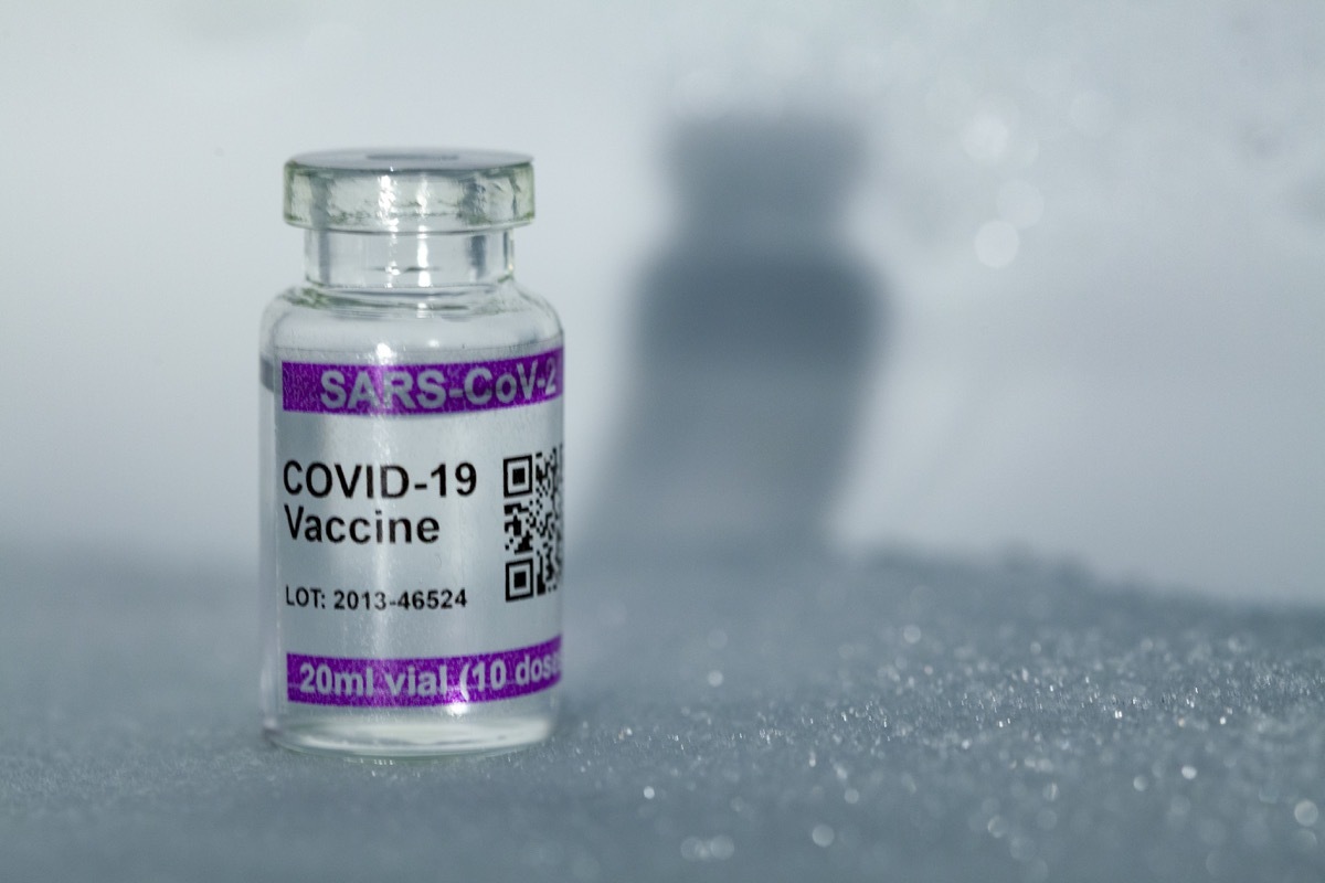 Bottles with COVID-19 (SARS-CoV-2) Coronavirus vaccine vial. Copy space provided. Note: QR code on bottles was generated by me and contains generic text: 