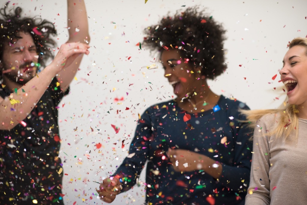 people dancing with confetti 