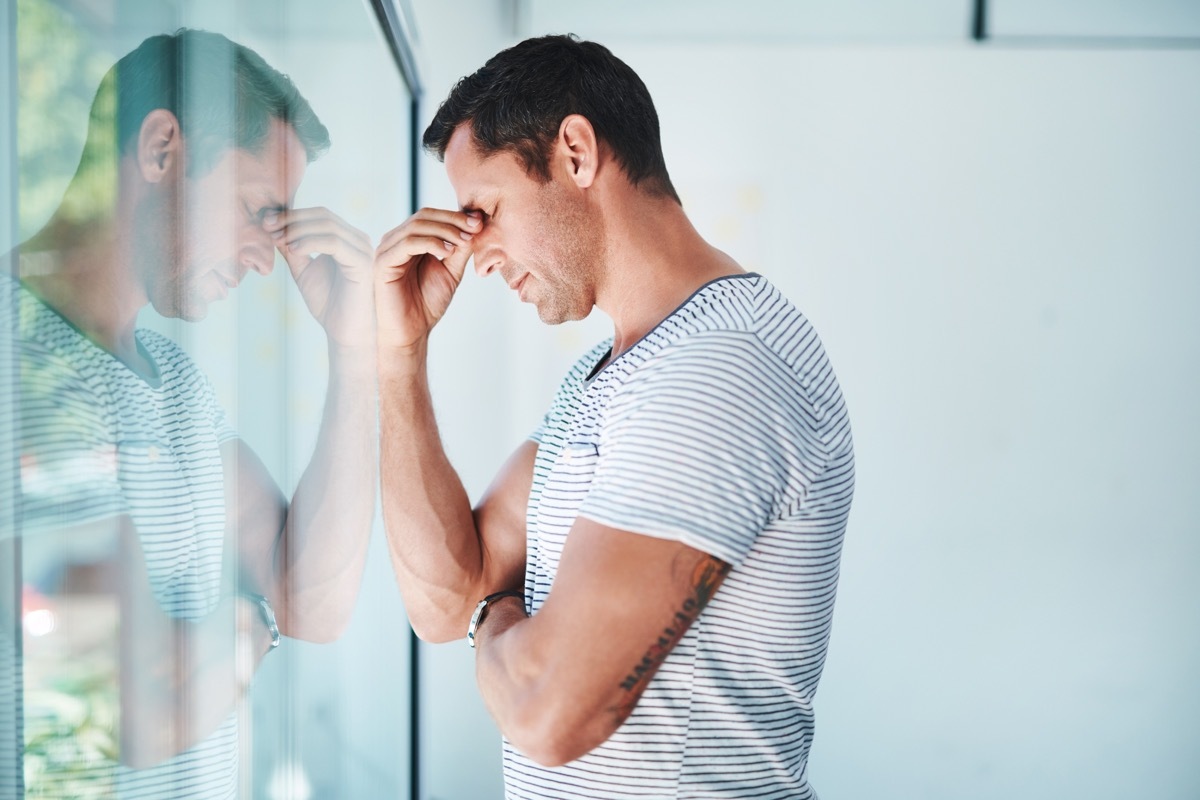 Shot of a mature businessman looking stressed out in an office