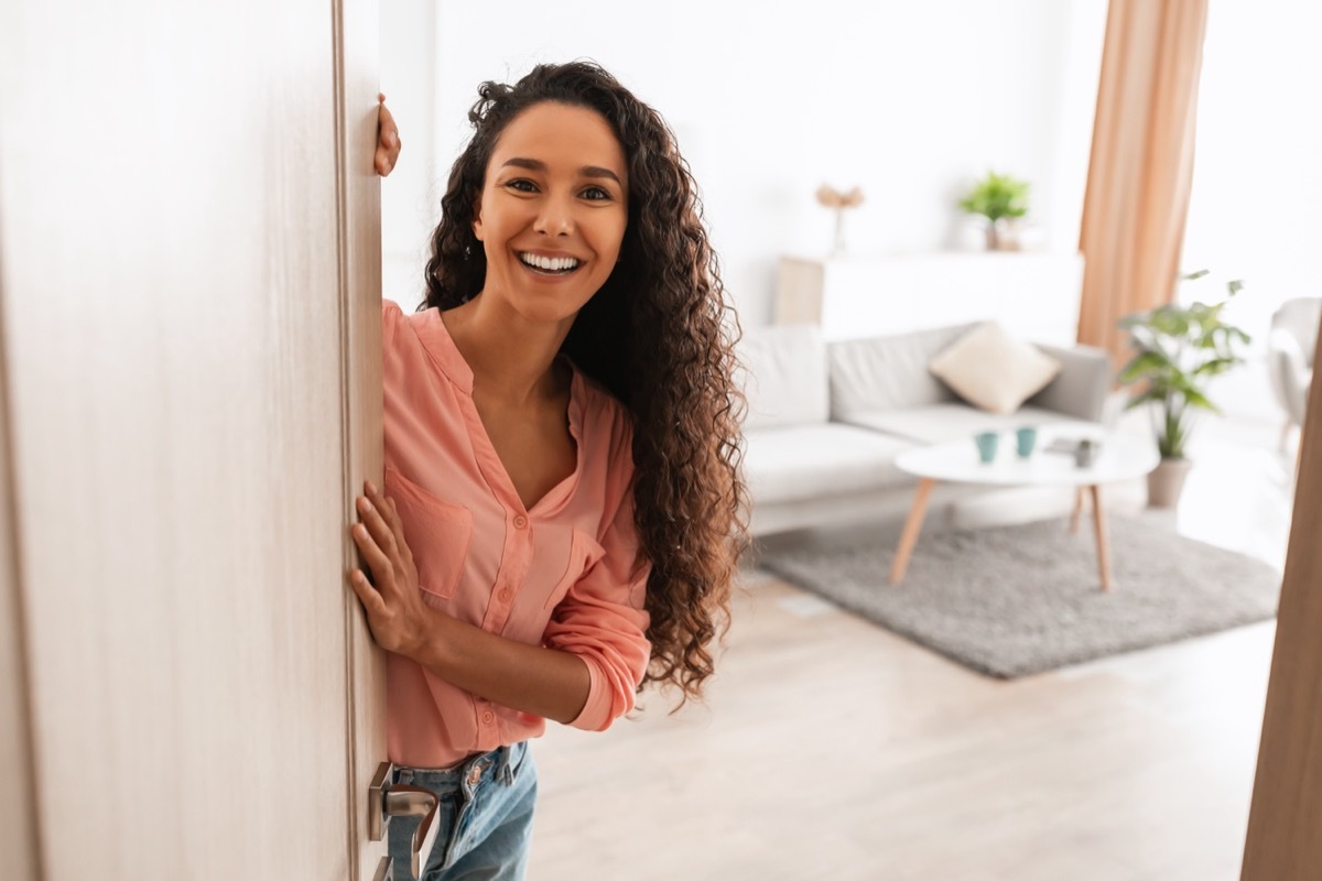 Woman Opening Up Her Home