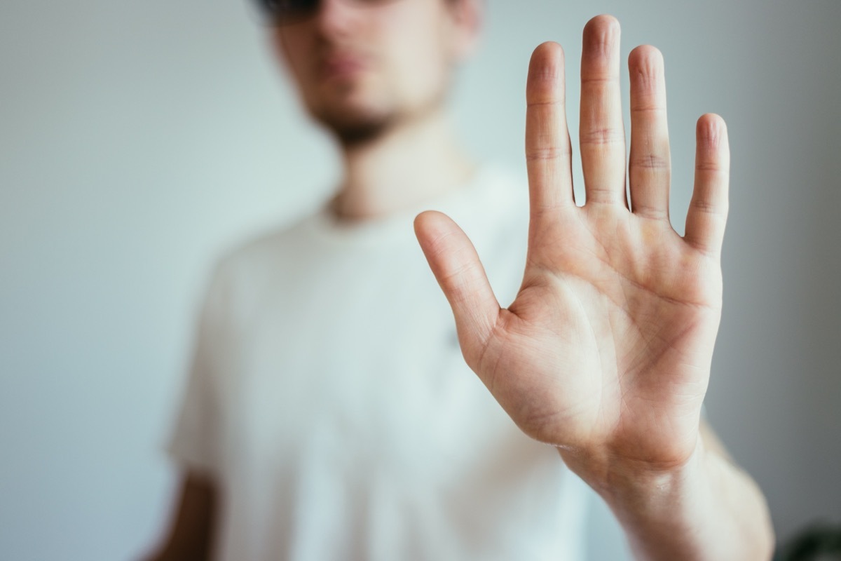 man showing stop gesture