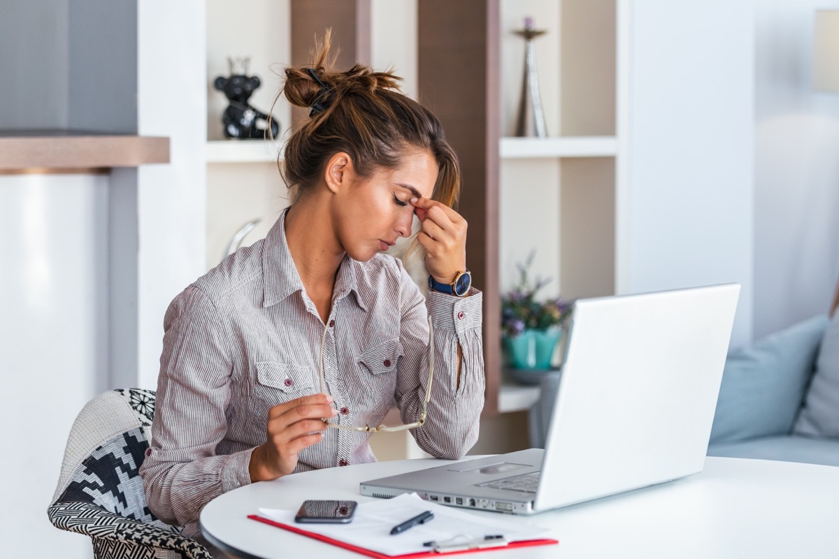 Woman experiencing a migraine