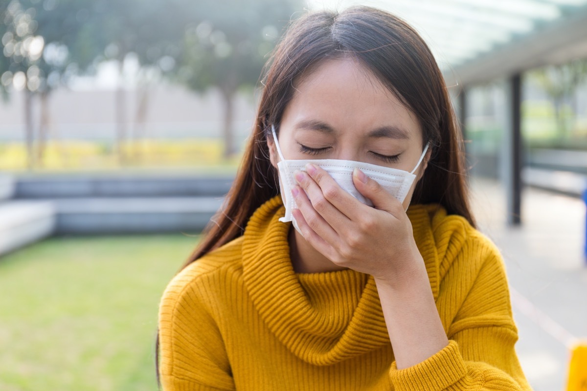 Woman coughing.