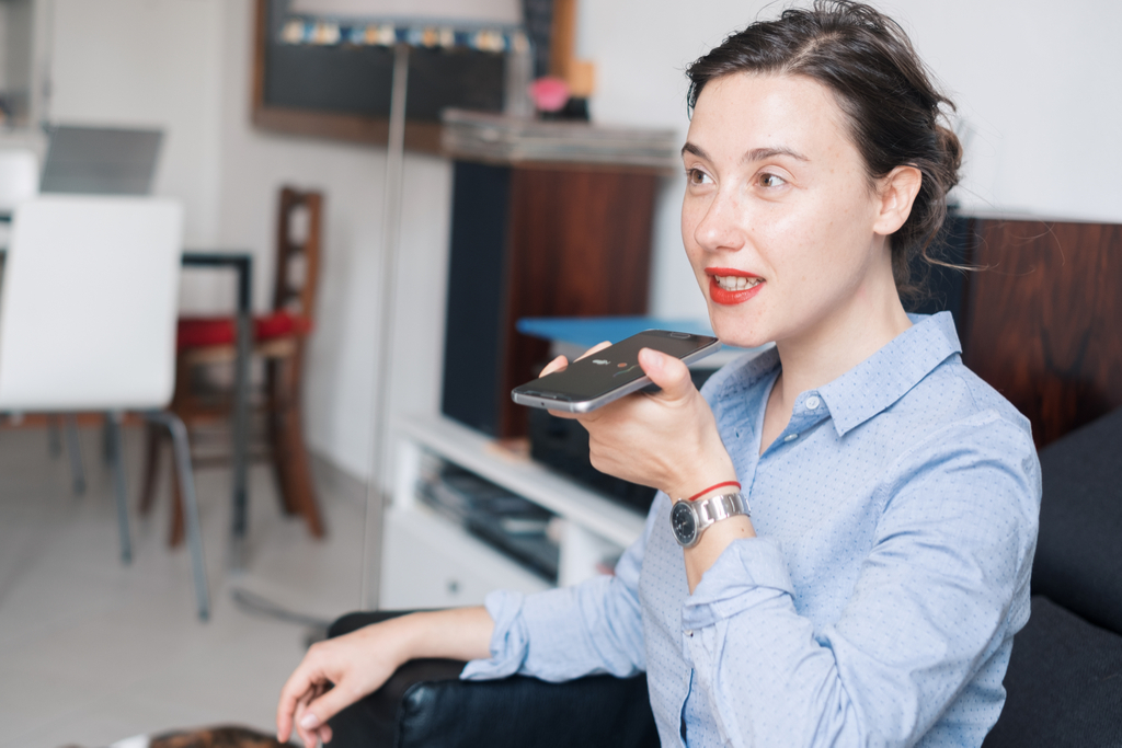 Woman Using Smartphone Voice Assistant