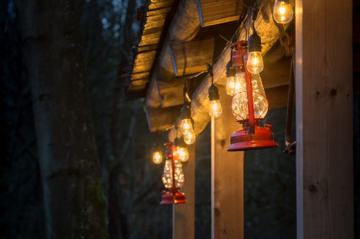 home exterior with red storm lanterns and twinkly lights