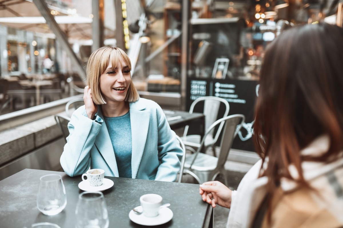 Coffee Time For Smiling Female Friends During Autumn Afternoon Outside