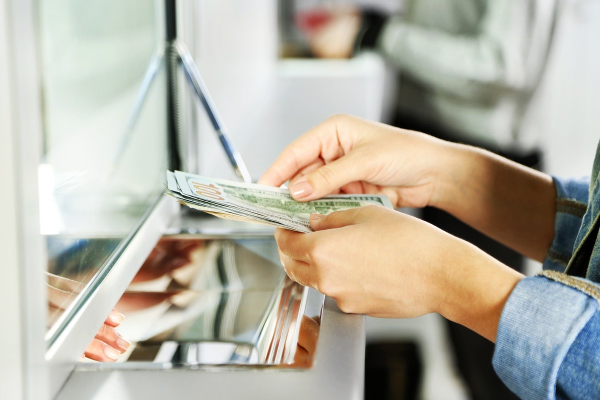 Woman depositing money at the bank