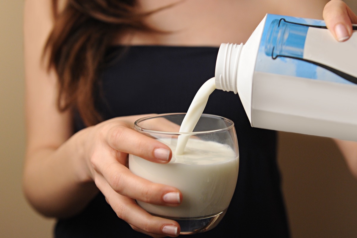 woman pouring milk