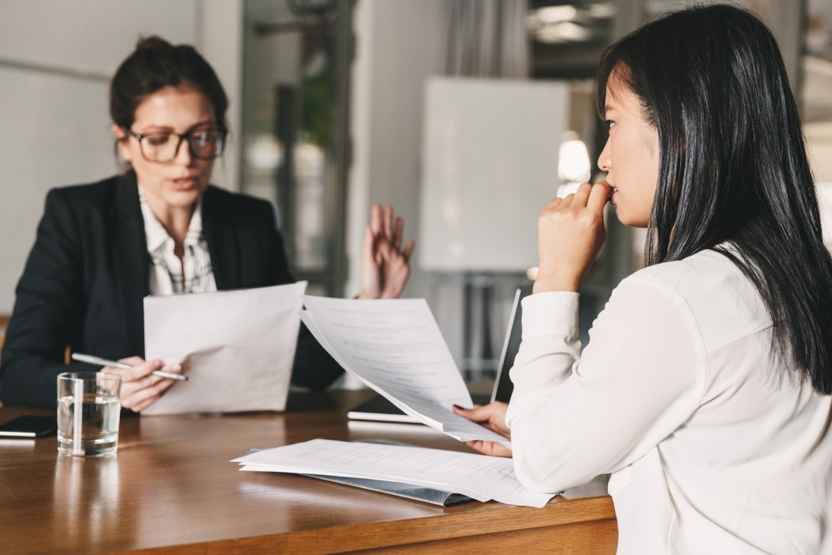 Nervous Young Woman Meeting with Boss