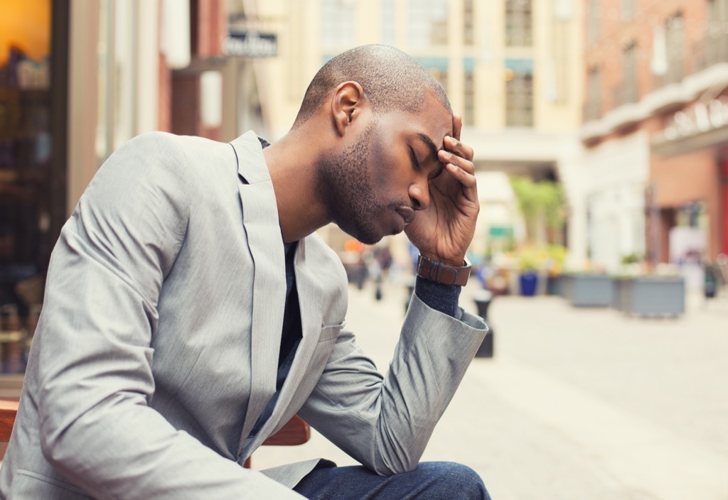 black man stressed on the street