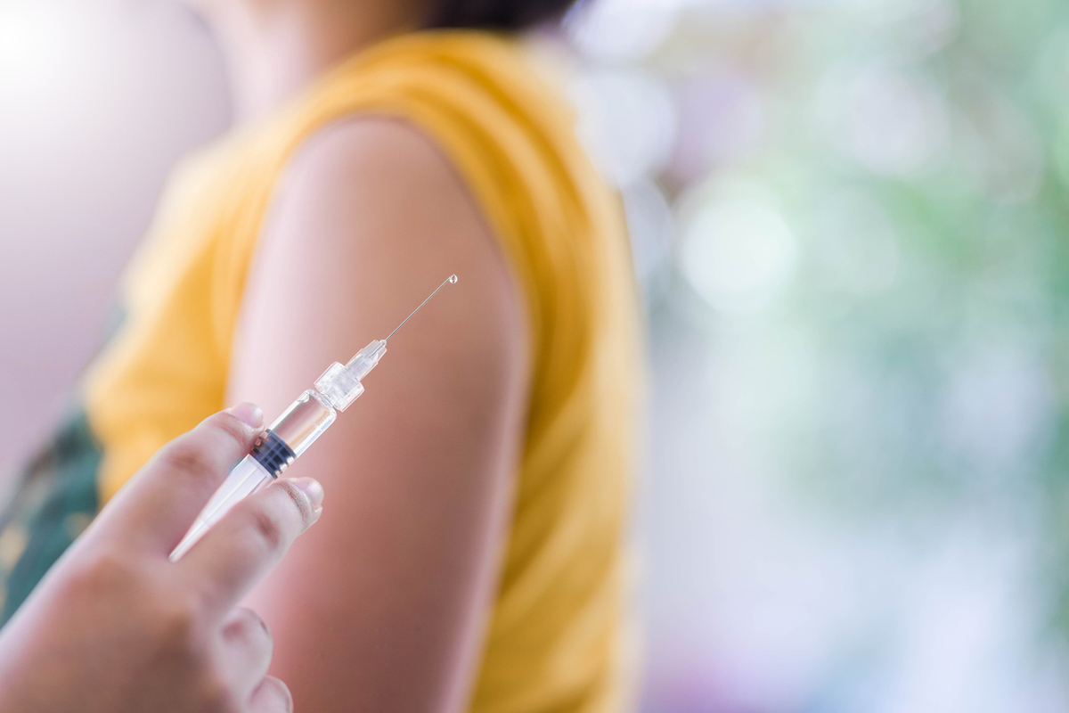 Closeup of doctor's hand preparing vaccination