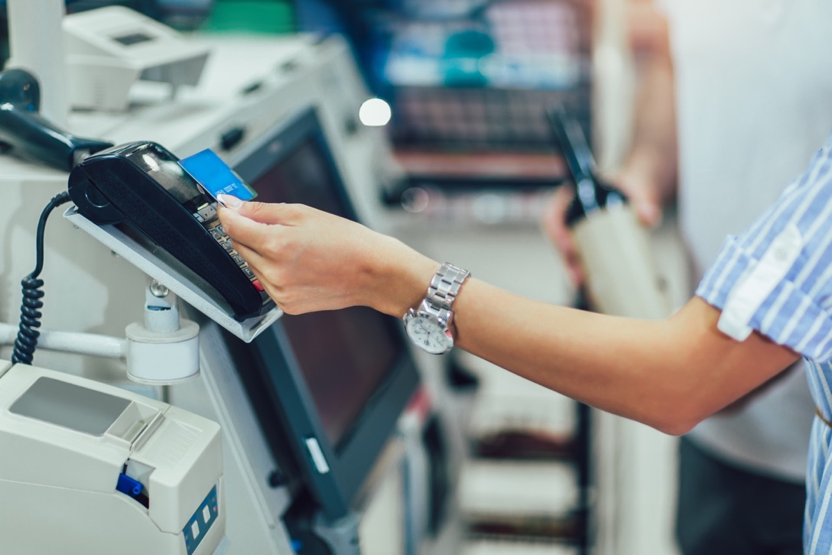 shopper using self-checkout