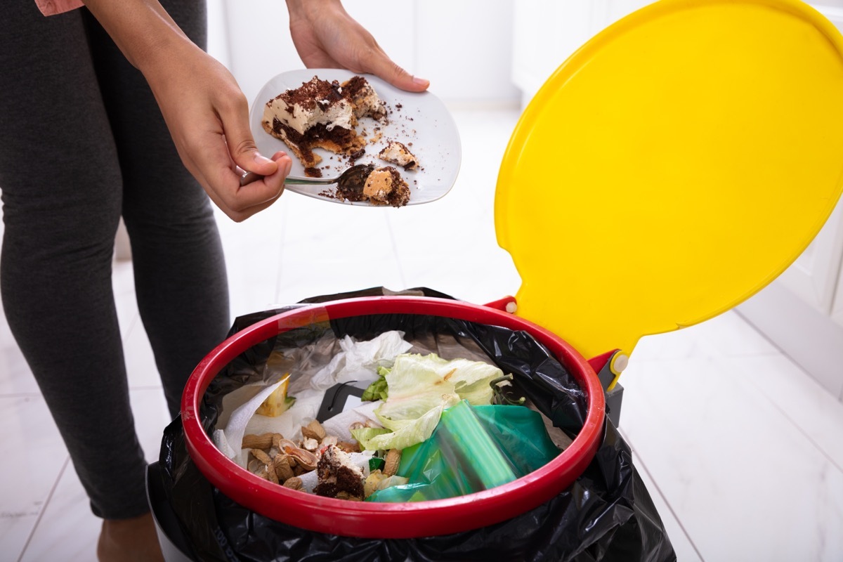 person throwing away trash