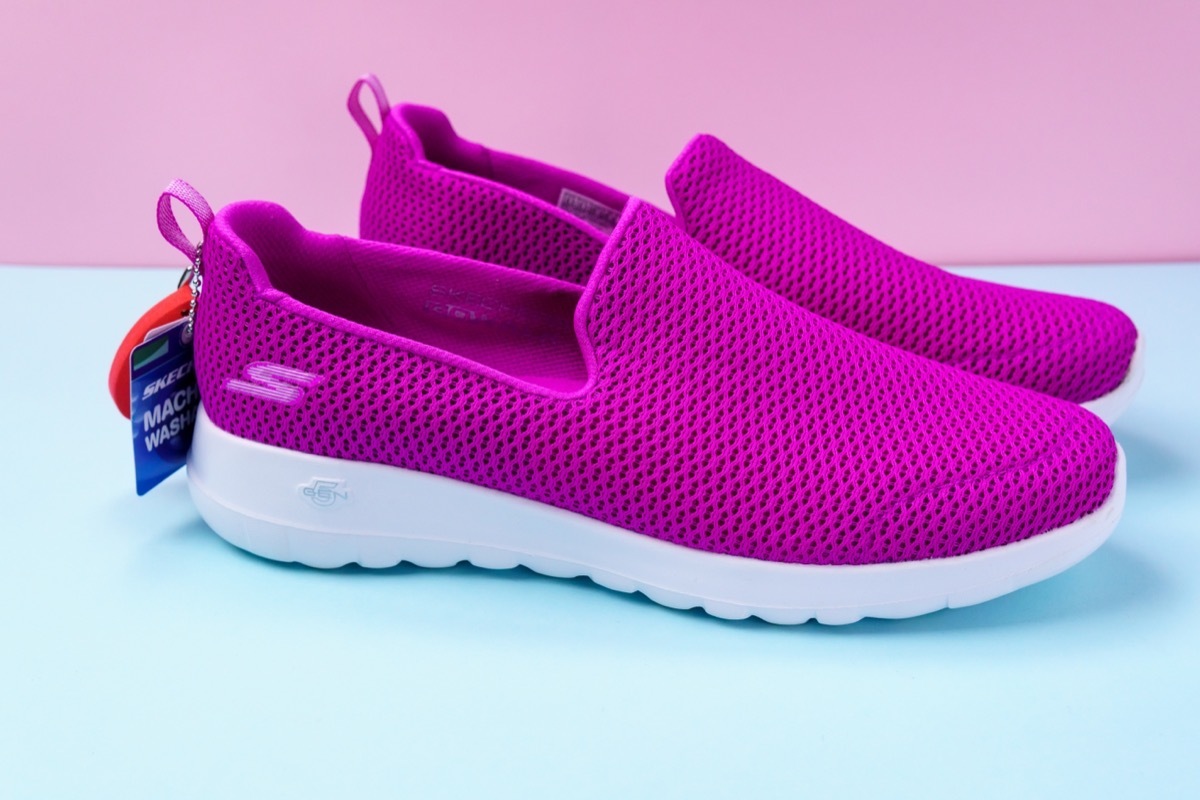 Tyumen, Russia-August 27, 2021: Slip-on shoes for women Skechers Go Walk Joy purple. Skechers USA, Inc. is an American lifestyle