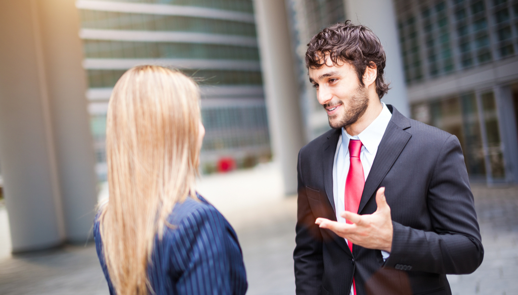 Man Talking to Female Coworker Slang Terms