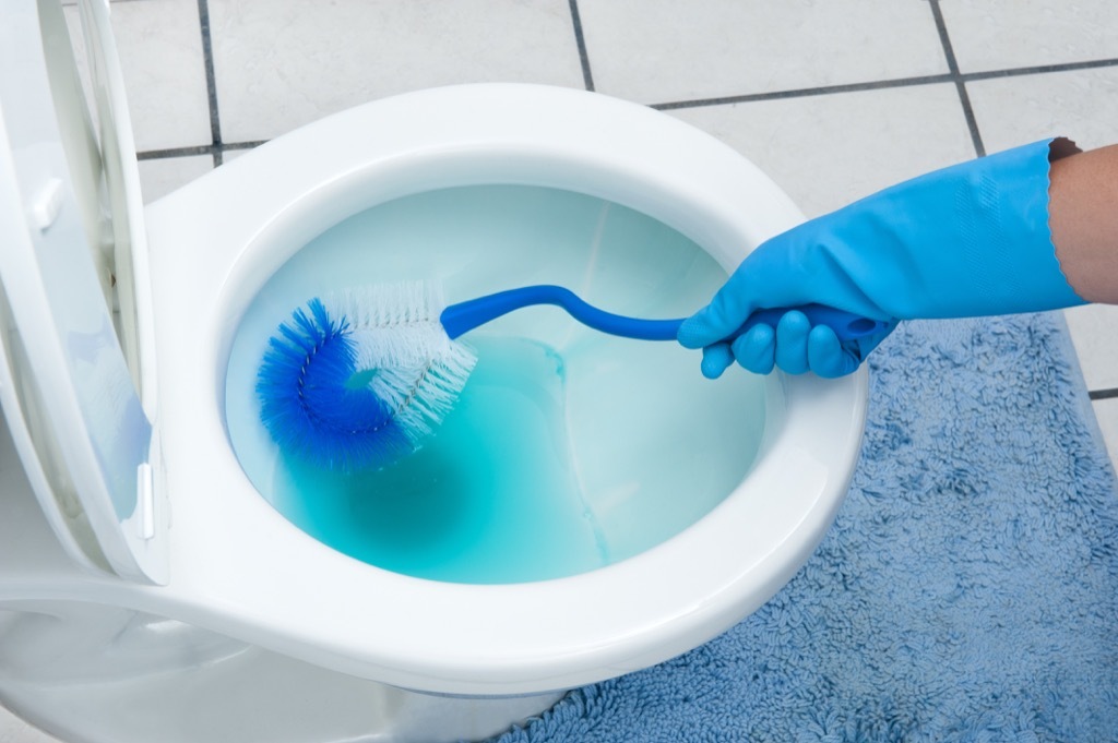 mom cleaning toilet