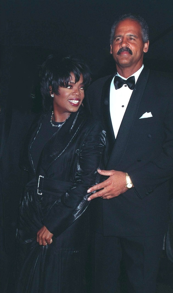 Oprah Winfrey wears a black dress and Stedman Graham wears a black suit at The People's Choice Awards in 1997