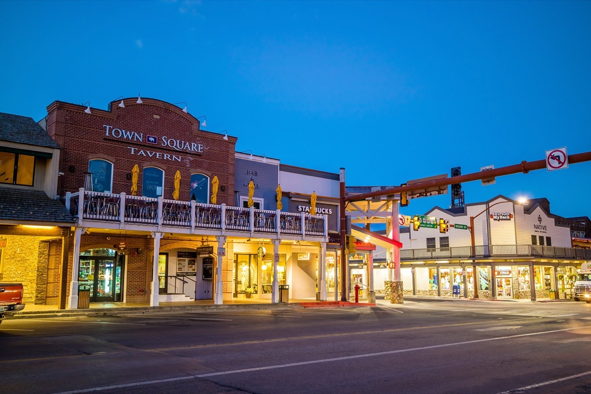 cityscape photos of stores and empty street in downtown Jackson Hole, Wyoming at night