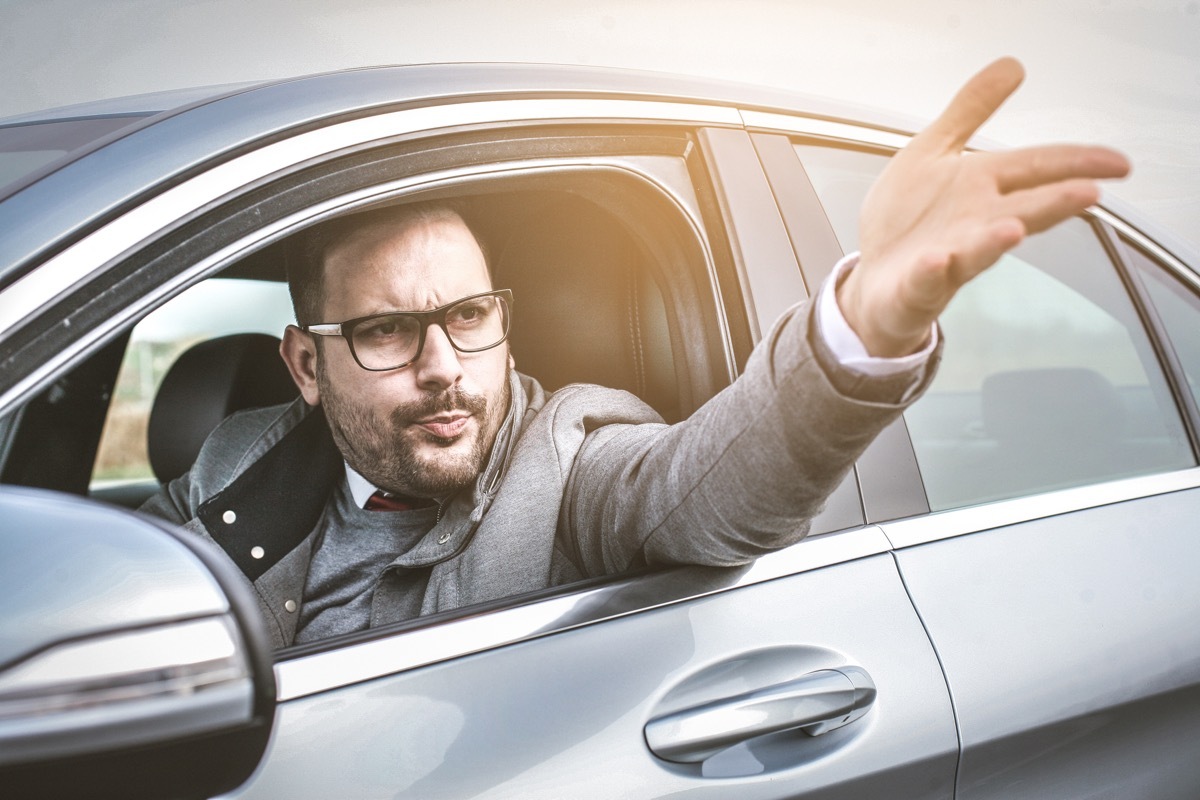 male driver shouts and gestures threateningly