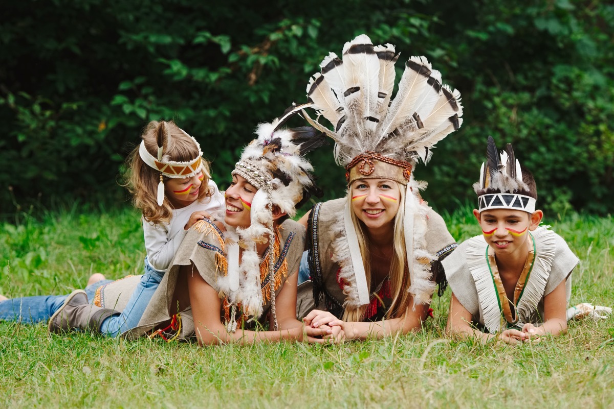 A family dressed inappropriately as Native Americans