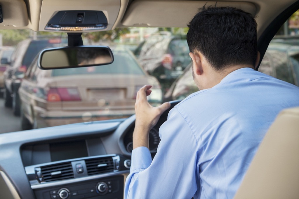 Man sitting in traffic angry