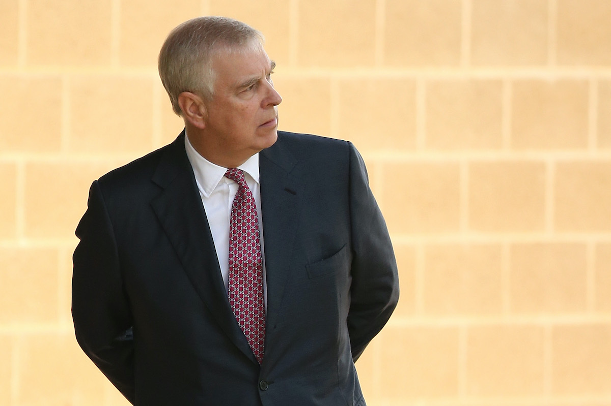 Prince Andrew looks on