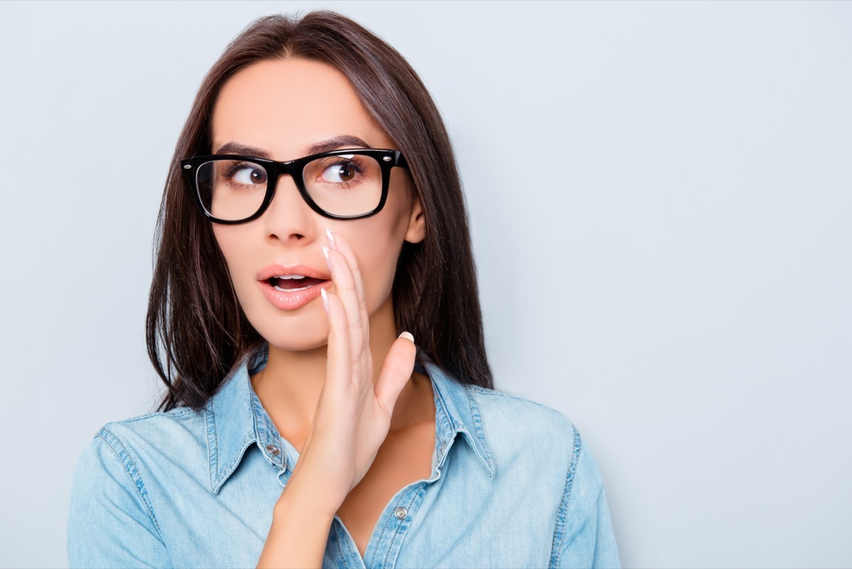 woman telling a lie in glasses. 