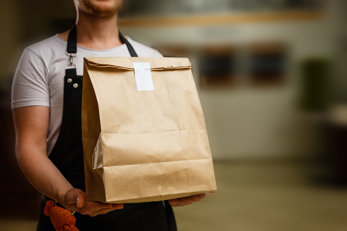 Delivery guy holding bag